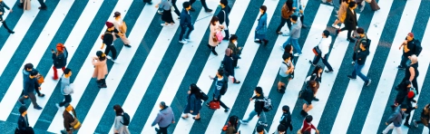 An image of pedestrians crossing the street. 