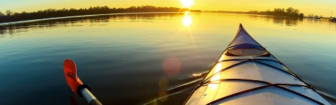 Canoe sailing straight on water