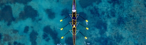 An aerial view of a team rowing 