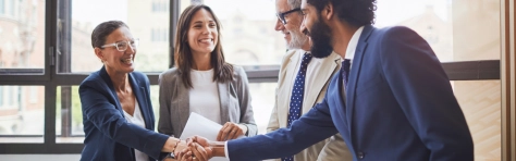 Business meeting with woman shaking hands with man