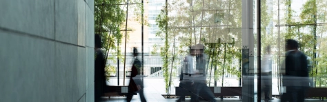 Business people walking through an urban office building