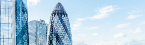 London skyline with the Gherkin skyscraper reflecting in glass skyscrapers, England - Brexit radar publication - London